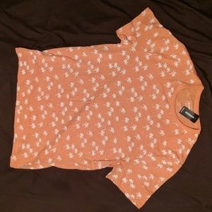 Orange tee with white palm trees